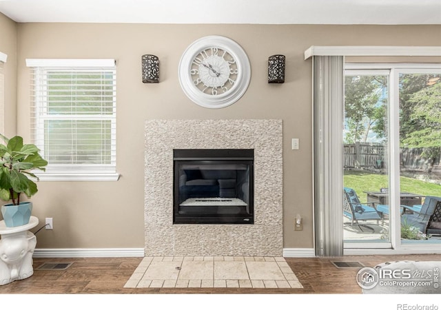11417 King Way, Westminster, CO 80031 - detailed view of wood finished floors and a fireplace with flush hearth
