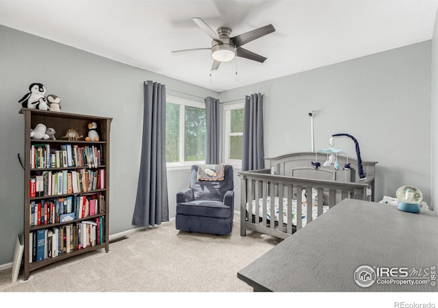 11417 King Way, Westminster, CO 80031 - bedroom with carpet, a crib, and a ceiling fan