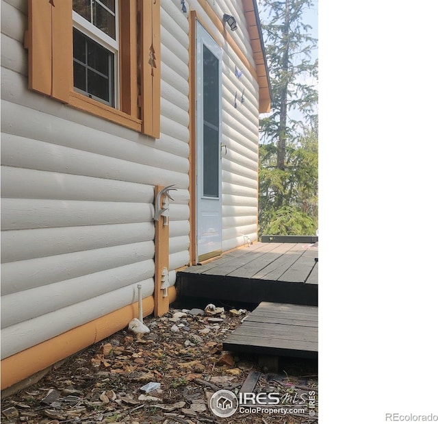 view of side of property featuring a deck