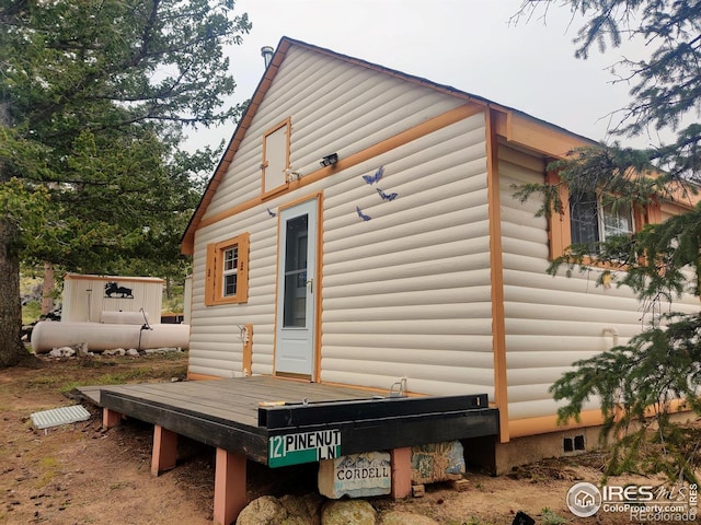 view of home's exterior featuring a deck