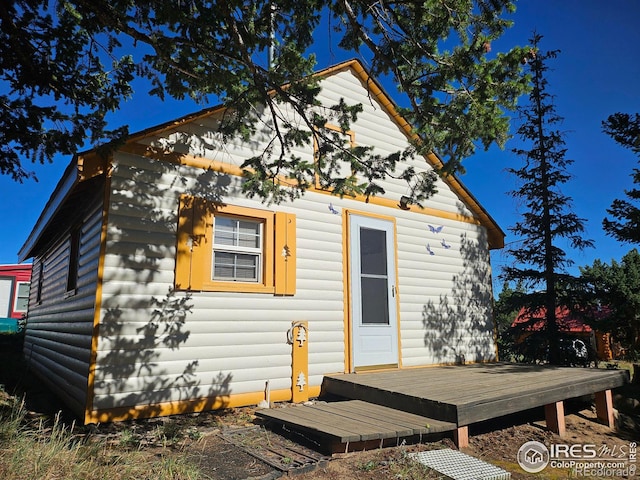 view of front of property featuring a wooden deck