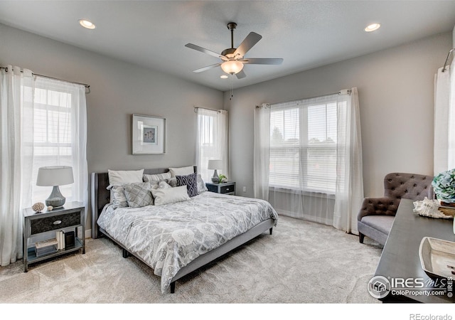 carpeted bedroom featuring ceiling fan