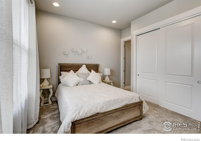 carpeted bedroom featuring a closet