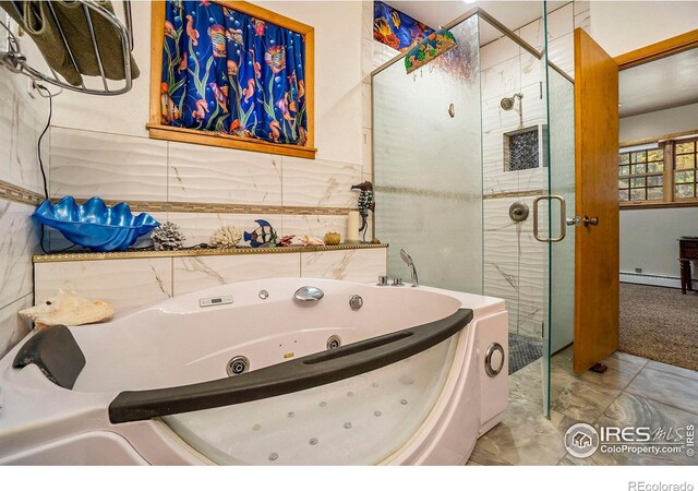 bathroom featuring separate shower and tub, baseboard heating, tile patterned flooring, and tile walls