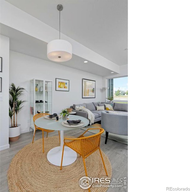 dining room with recessed lighting and light wood-style floors