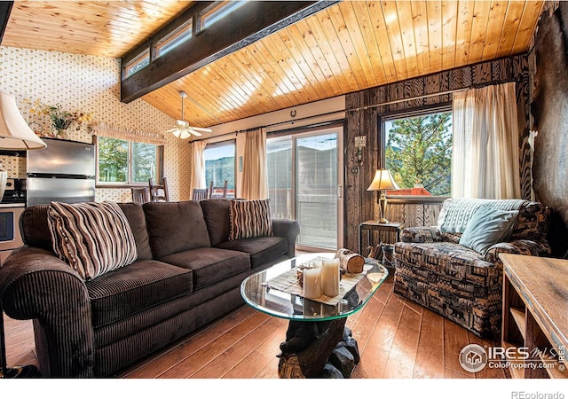 living room with wood-type flooring, vaulted ceiling with beams, ceiling fan, and wooden ceiling