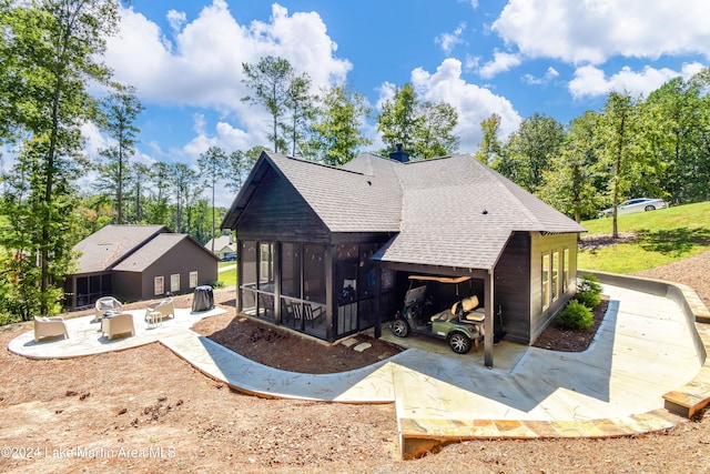 back of house with a sunroom