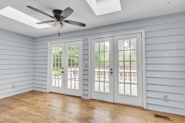 226 Auburn Dr, Alexander City, AL 35010 - doorway to outside with french doors, a skylight, and wood finished floors