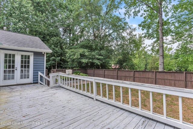 226 Auburn Dr, Alexander City, AL 35010 - wooden deck featuring french doors, a fenced backyard, and view of wooded area