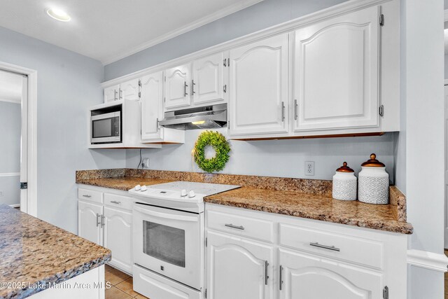 226 Auburn Dr, Alexander City, AL 35010 - kitchen with electric range, under cabinet range hood, built in microwave, white cabinets, and light tile patterned flooring