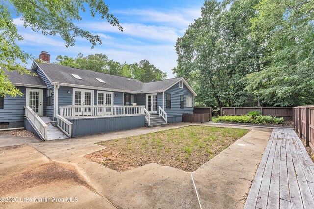 226 Auburn Dr, Alexander City, AL 35010 - back of property featuring french doors, a deck, a chimney, a patio area, and a shingled roof
