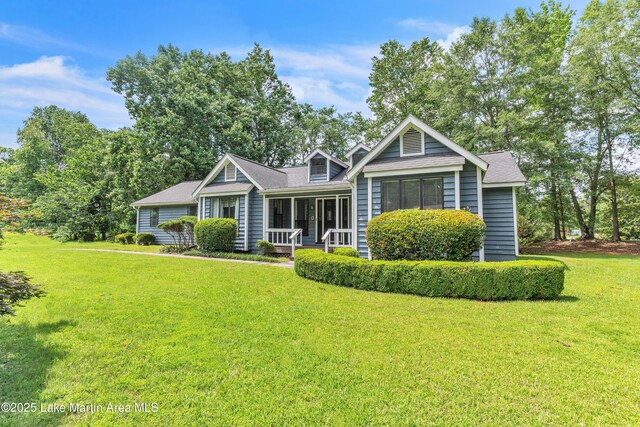 226 Auburn Dr, Alexander City, AL 35010 - view of front of house featuring a front yard and a sunroom