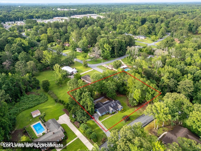 226 Auburn Dr, Alexander City, AL 35010 - aerial overview of property's location with a heavily wooded area and property parcel outlined