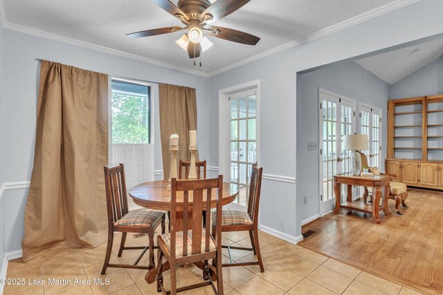 226 Auburn Dr, Alexander City, AL 35010 - dining room featuring light tile patterned floors, a ceiling fan, crown molding, and vaulted ceiling