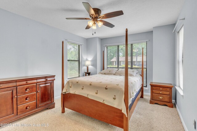 226 Auburn Dr, Alexander City, AL 35010 - bedroom with light colored carpet and a ceiling fan