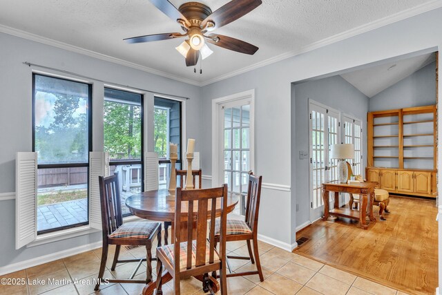 226 Auburn Dr, Alexander City, AL 35010 - dining space with light tile patterned floors, ceiling fan, crown molding, a textured ceiling, and lofted ceiling