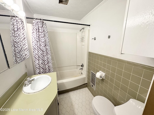 2821 Hillabee Rd, Alexander City, AL 35010 - full bath with tile walls, a textured ceiling, toilet, tile patterned floors, and vanity