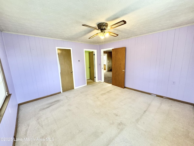 2821 Hillabee Rd, Alexander City, AL 35010 - unfurnished bedroom featuring carpet flooring, a textured ceiling, ceiling fan, and crown molding