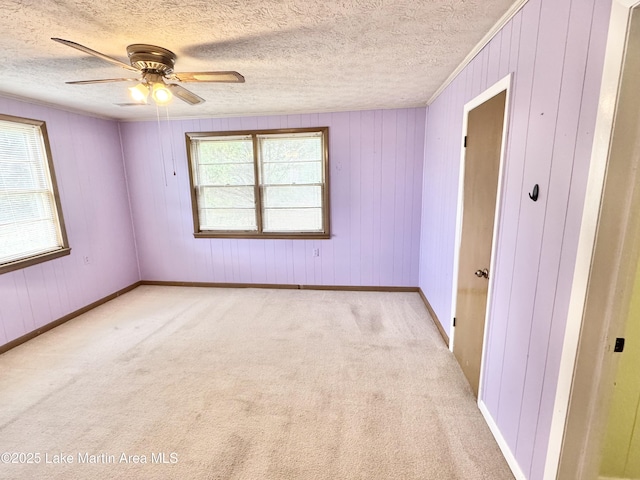2821 Hillabee Rd, Alexander City, AL 35010 - unfurnished room with light carpet, baseboards, ceiling fan, and a textured ceiling