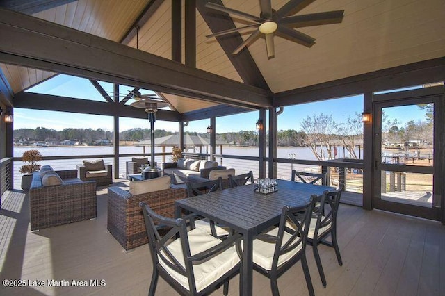 view of patio featuring outdoor dining space, an outdoor hangout area, a ceiling fan, and a water view