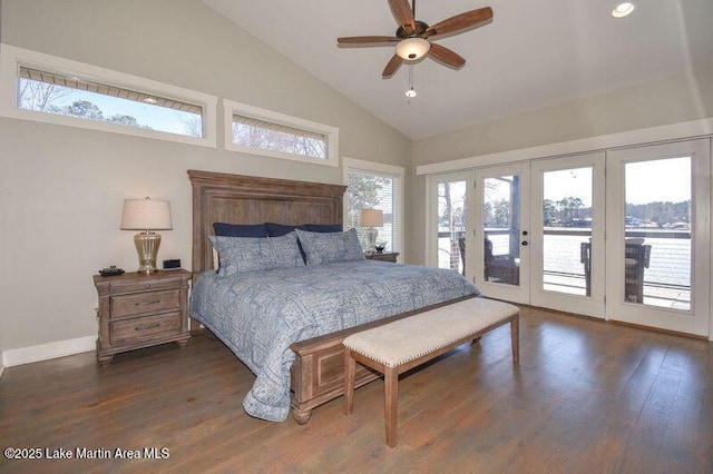 bedroom featuring dark wood-style floors, baseboards, high vaulted ceiling, and access to exterior