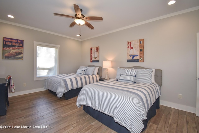 bedroom featuring a ceiling fan, wood finished floors, baseboards, recessed lighting, and ornamental molding