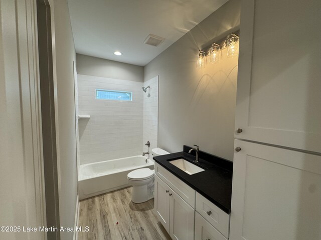 27 Bob Lo Dr, Dadeville, AL 36853 - bathroom featuring wood finished floors and shower / bath combination