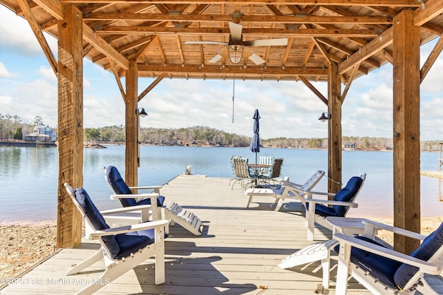 dock area with a gazebo and a water view