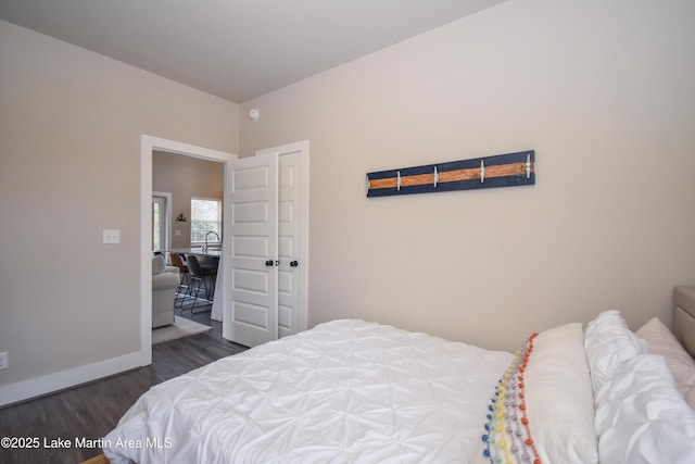 bedroom featuring dark hardwood / wood-style floors