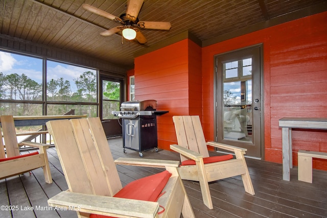 sunroom / solarium with ceiling fan and wood ceiling