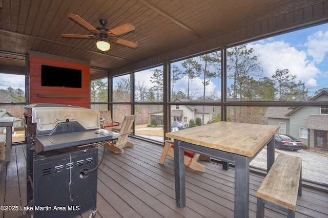 sunroom / solarium with ceiling fan and wooden ceiling