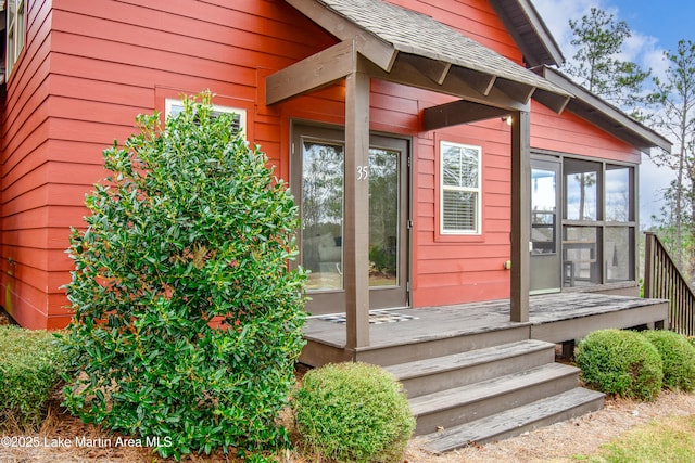 doorway to property with a wooden deck