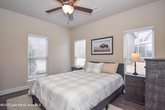 bedroom featuring ceiling fan and dark wood-type flooring