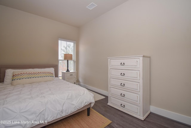 bedroom featuring dark hardwood / wood-style floors