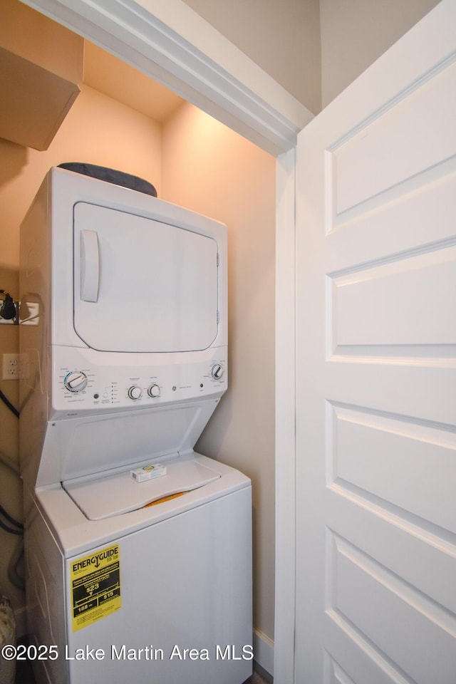 laundry area with stacked washer / dryer