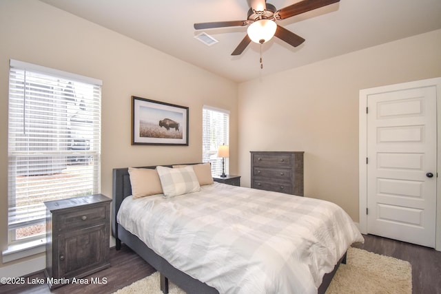 bedroom featuring ceiling fan and dark hardwood / wood-style flooring