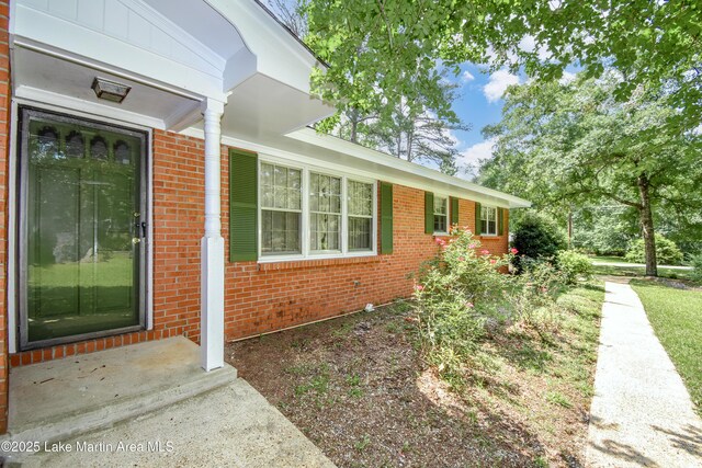300 Hornsby Dr, Tallassee, AL 36078 - view of home's exterior featuring brick siding