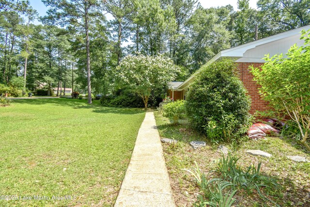 300 Hornsby Dr, Tallassee, AL 36078 - view of green lawn with view of scattered trees