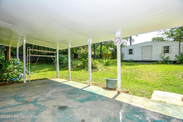 300 Hornsby Dr, Tallassee, AL 36078 - view of patio / terrace featuring an outbuilding