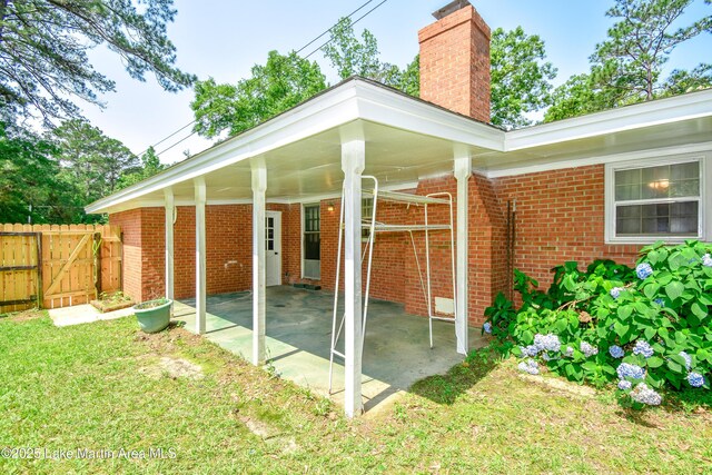300 Hornsby Dr, Tallassee, AL 36078 - view of patio / terrace featuring a gate