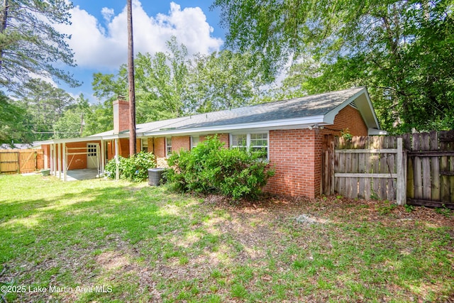 300 Hornsby Dr, Tallassee, AL 36078 - rear view of property with a chimney and brick siding