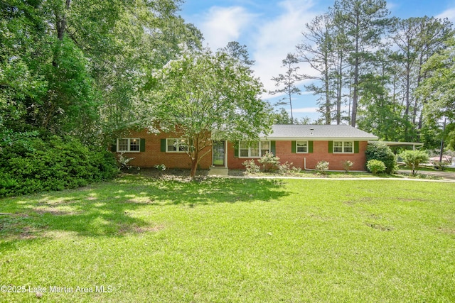 300 Hornsby Dr, Tallassee, AL 36078 - view of front facade featuring brick siding and a front yard