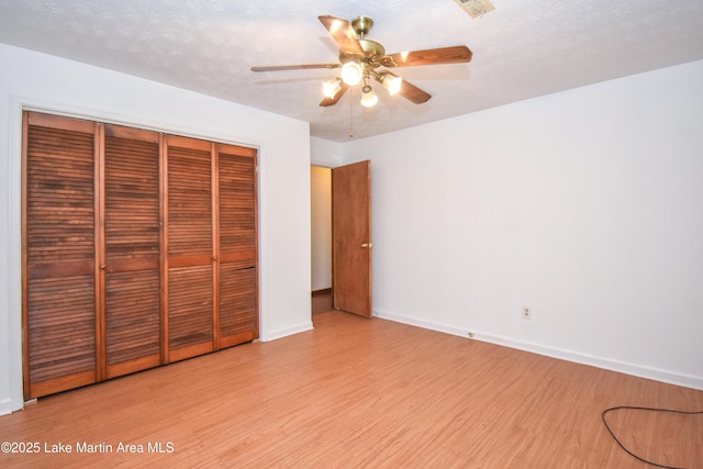 300 Hornsby Dr, Tallassee, AL 36078 - unfurnished bedroom with light wood-style floors, a closet, and baseboards