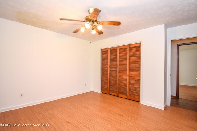 300 Hornsby Dr, Tallassee, AL 36078 - unfurnished bedroom featuring light wood-style flooring, a closet, and baseboards