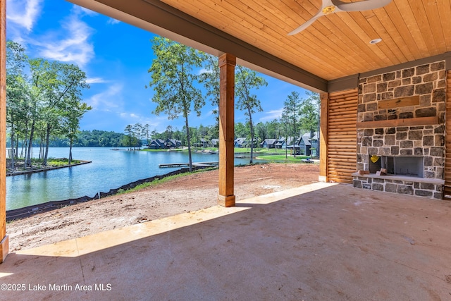 194 Oliver Way, Dadeville, AL 36853 - view of patio with a ceiling fan, a water view, and an outdoor stone fireplace