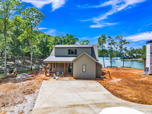 194 Oliver Way, Dadeville, AL 36853 - view of front of property featuring covered porch, a water view, and a metal roof