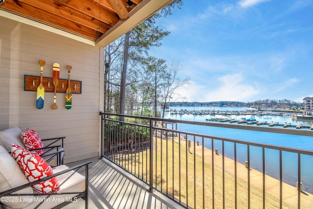 balcony featuring a water view