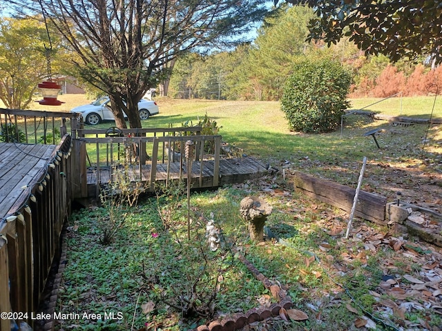 view of yard featuring a wooden deck