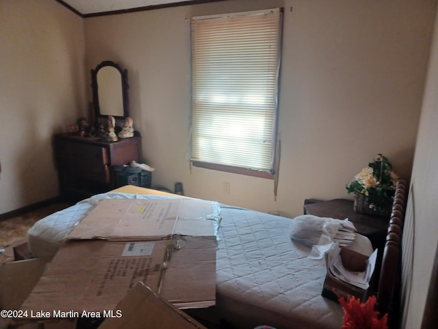 bedroom featuring crown molding