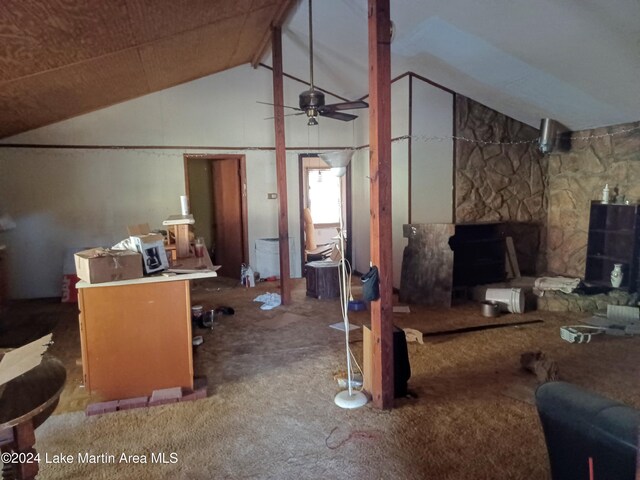 interior space featuring carpet flooring, high vaulted ceiling, and ceiling fan